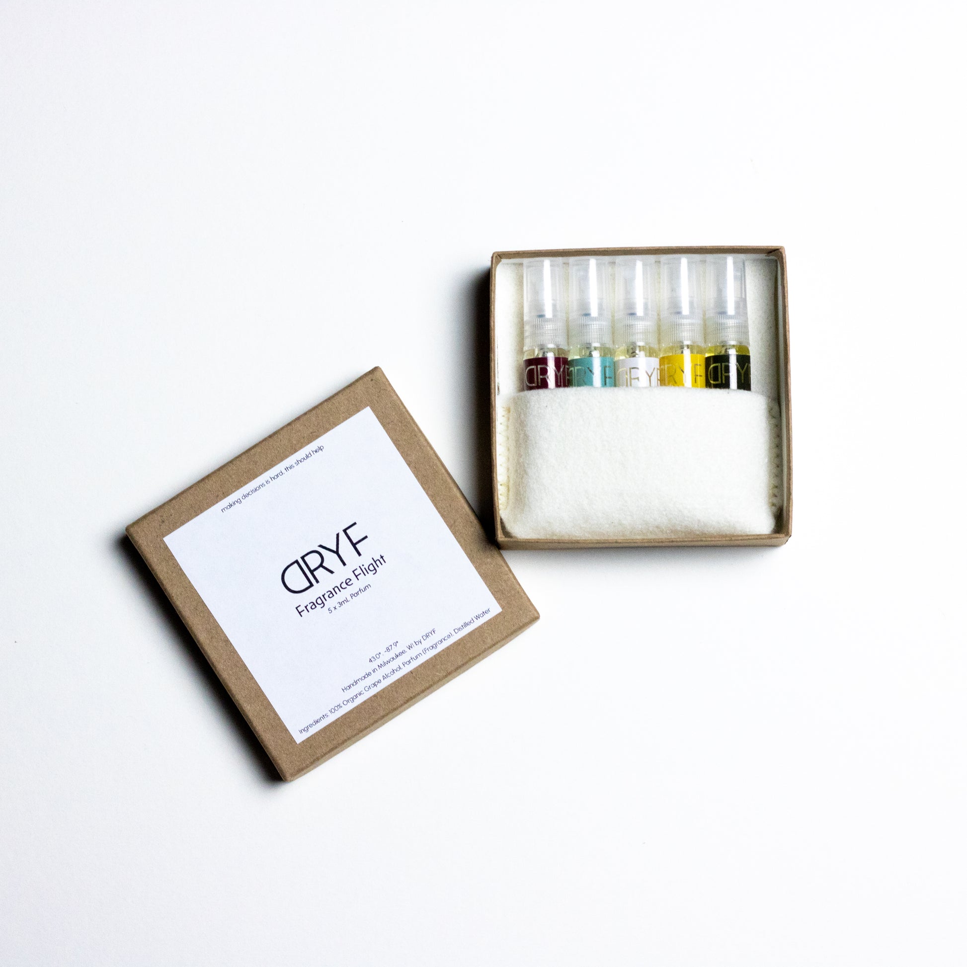Handcrafted fragrance flight by DRYF, offering five unique scents in 3mL samples, nestled in a hand-stitched wool felt pocket.
