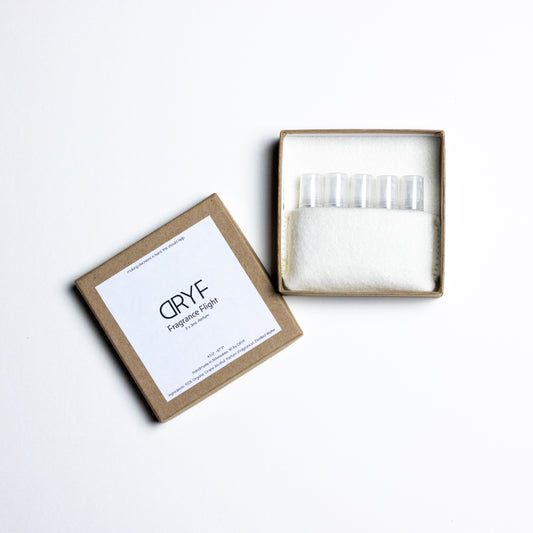 DRYF Fragrance Flight featuring five signature unisex scents in 3mL glass samples, perfect for layering and discovering your ideal fragrance.