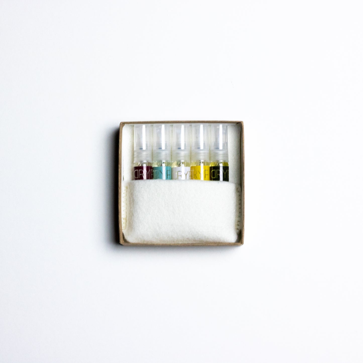 Discover your perfect fragrance with DRYF's Fragrance Flight—five signature scents in travel-sized 3mL samples, packaged in wool felt.