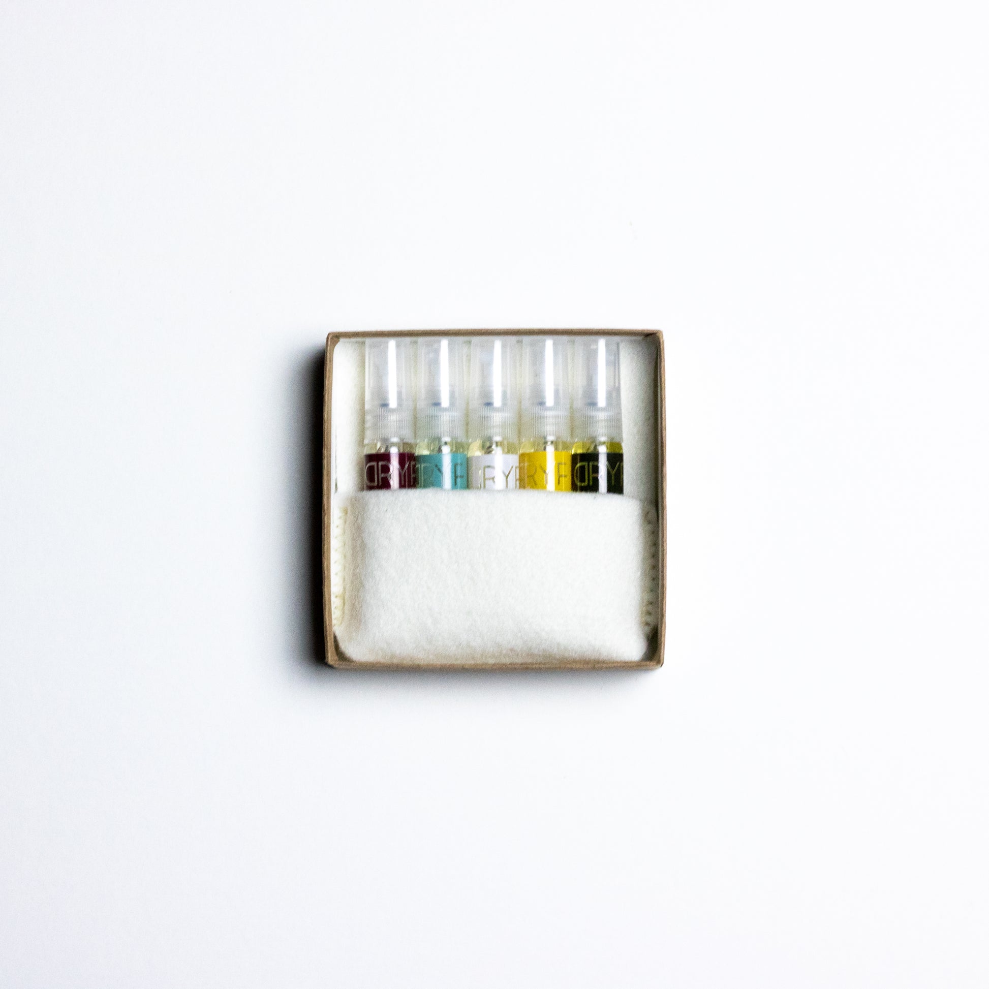 Discover your perfect fragrance with DRYF's Fragrance Flight—five signature scents in travel-sized 3mL samples, packaged in wool felt.