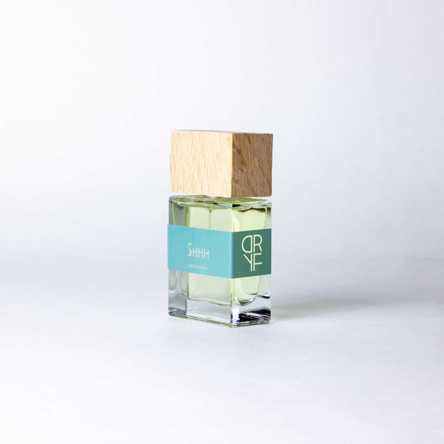 Unisex fragrance Shhh by DRYF, offering a serene blend of sea salt, coconut, and warm santal, evoking peaceful moments by the sea.
