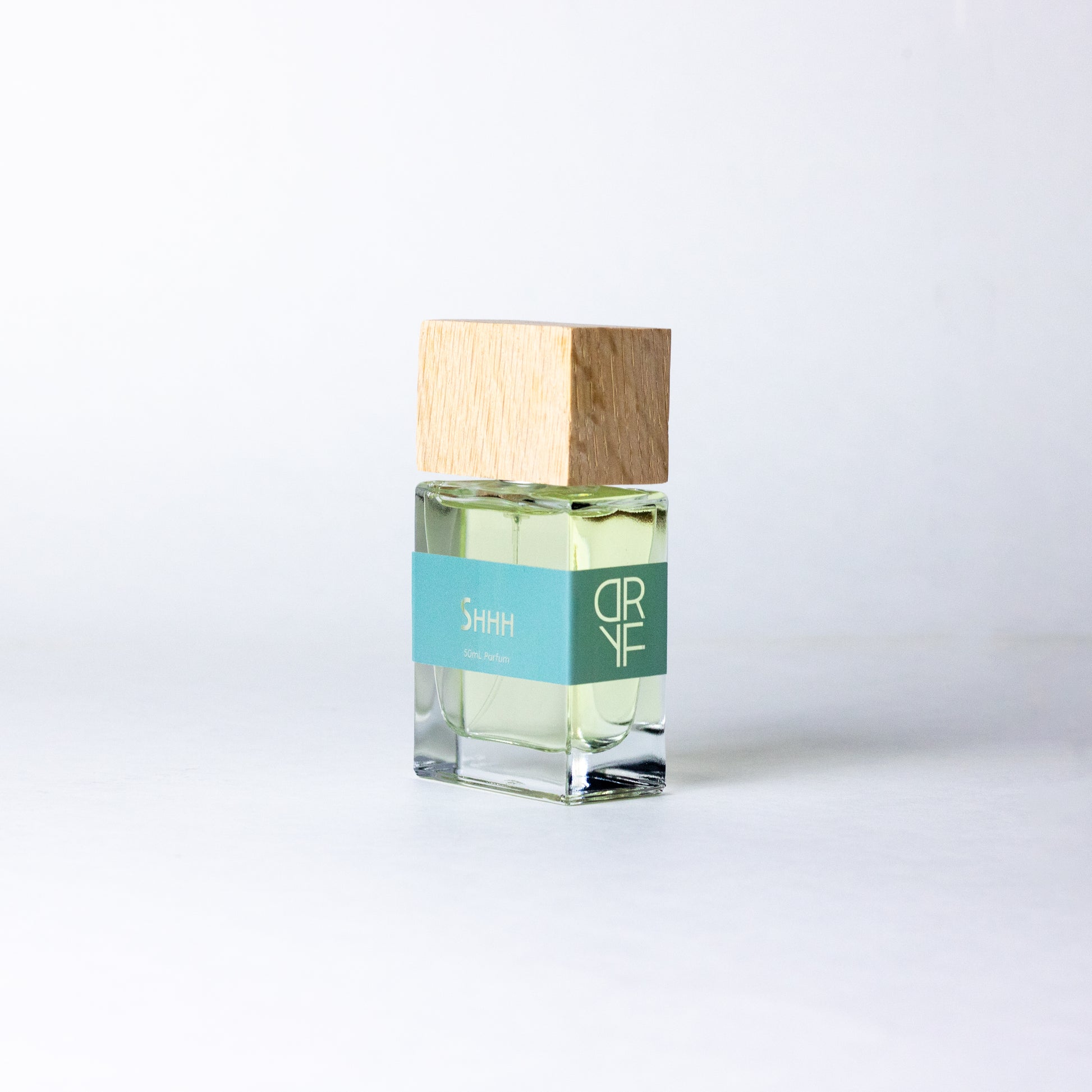 Unisex fragrance Shhh by DRYF, offering a serene blend of sea salt, coconut, and warm santal, evoking peaceful moments by the sea.