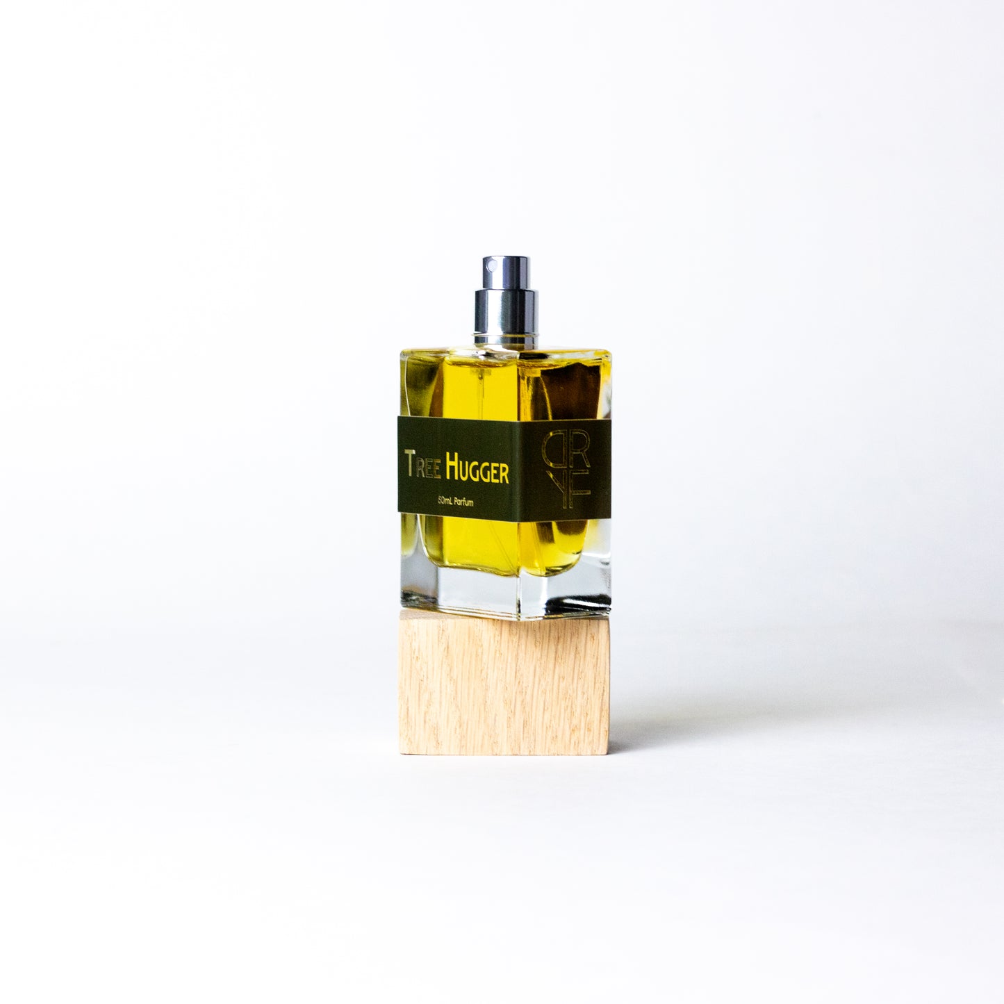 Handcrafted unisex fragrance Tree Hugger by DRYF, celebrating the natural world with woody and herbal notes of sandalwood, fir balsam, and patchouli.