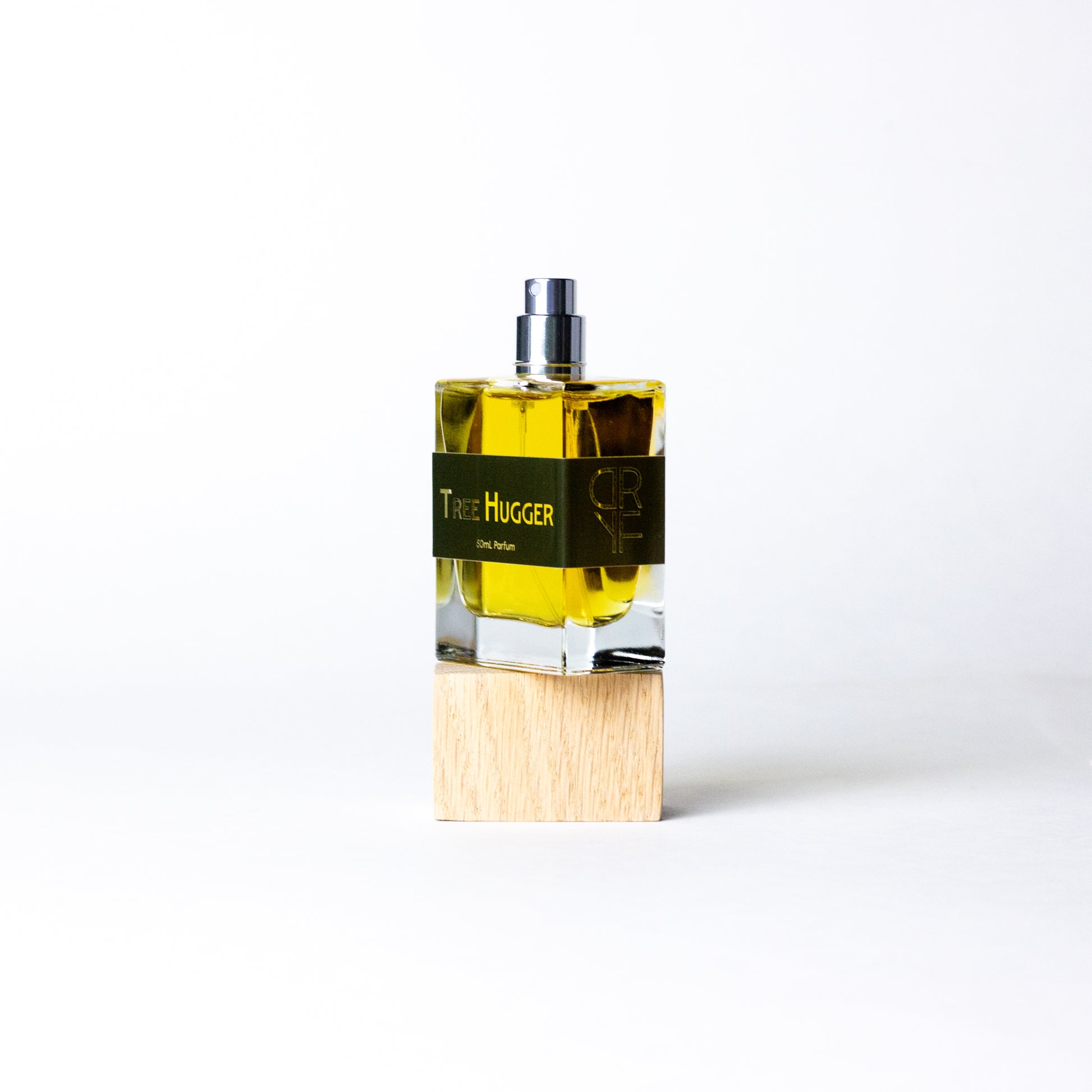 Handcrafted unisex fragrance Tree Hugger by DRYF, celebrating the natural world with woody and herbal notes of sandalwood, fir balsam, and patchouli.
