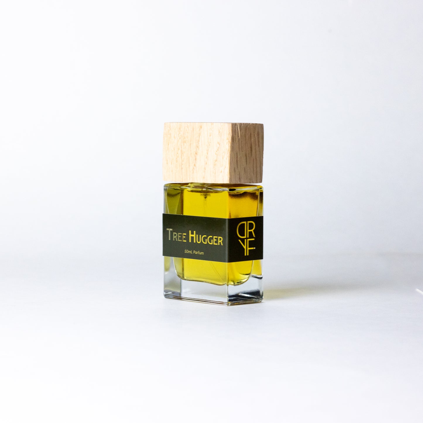 Unisex fragrance Tree Hugger by DRYF, featuring a blend of sandalwood, Tunisian rosemary, and patchouli, evoking the tranquility of the forest.
