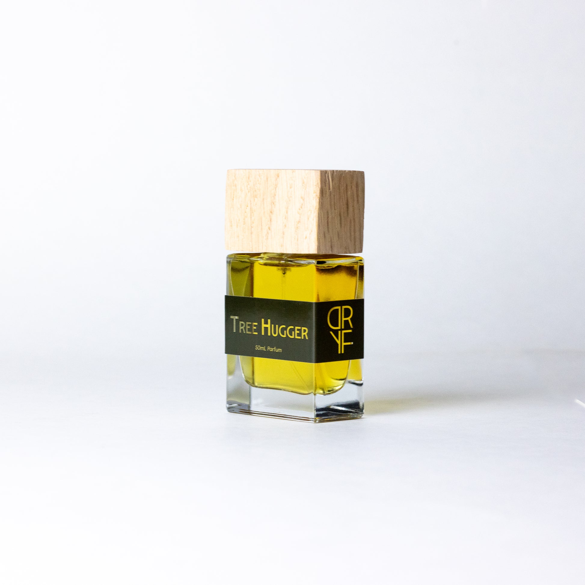 Unisex fragrance Tree Hugger by DRYF, featuring a blend of sandalwood, Tunisian rosemary, and patchouli, evoking the tranquility of the forest.