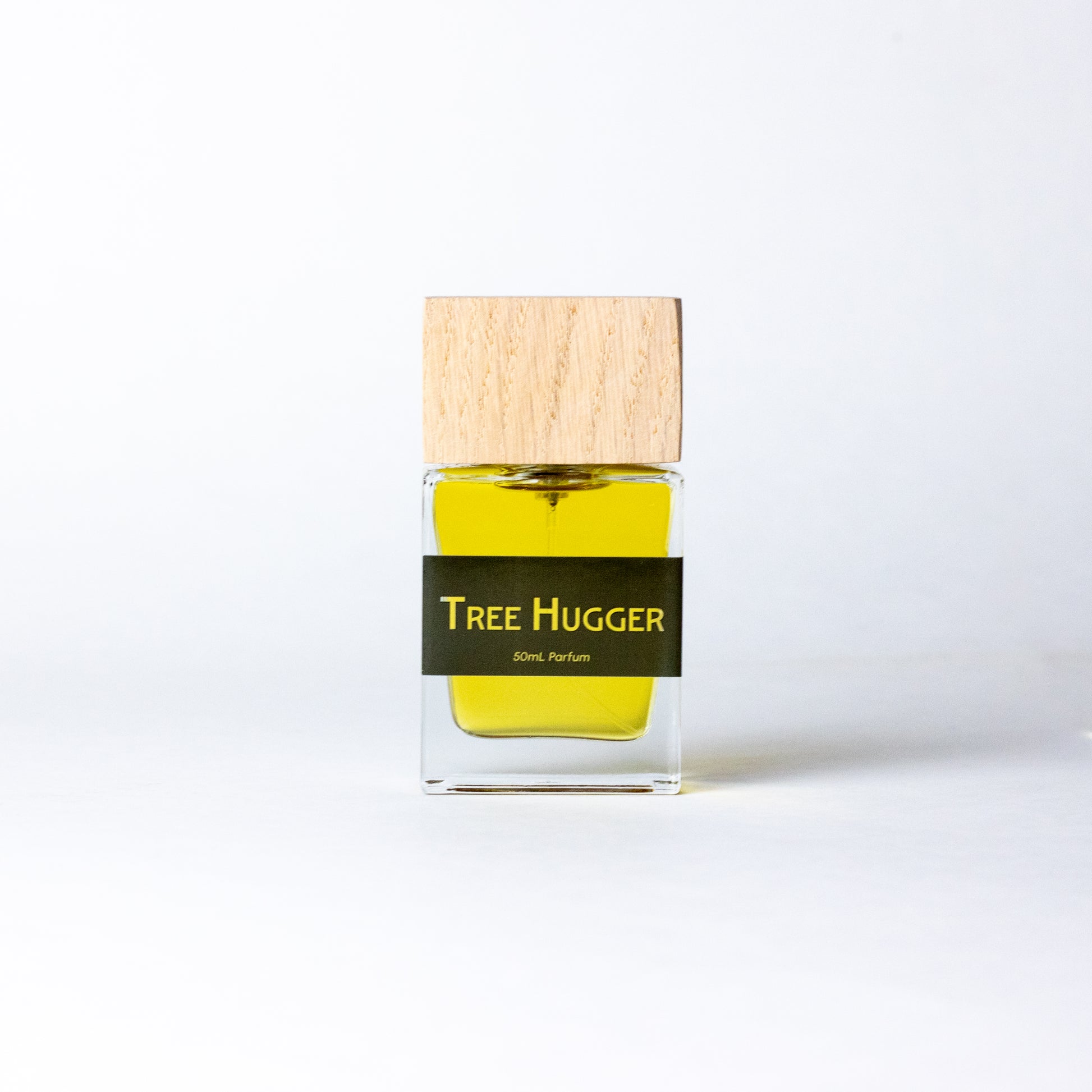 ree Hugger by DRYF, a handcrafted unisex fragrance with woody sandalwood, fir balsam, and earthy patchouli for a grounding, nature-inspired scent.